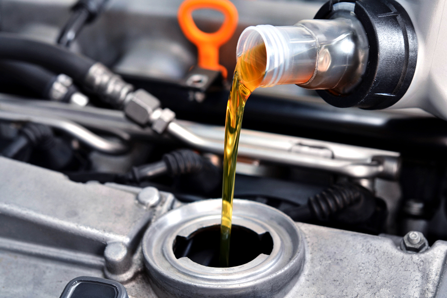 oil being poured into an oil tank