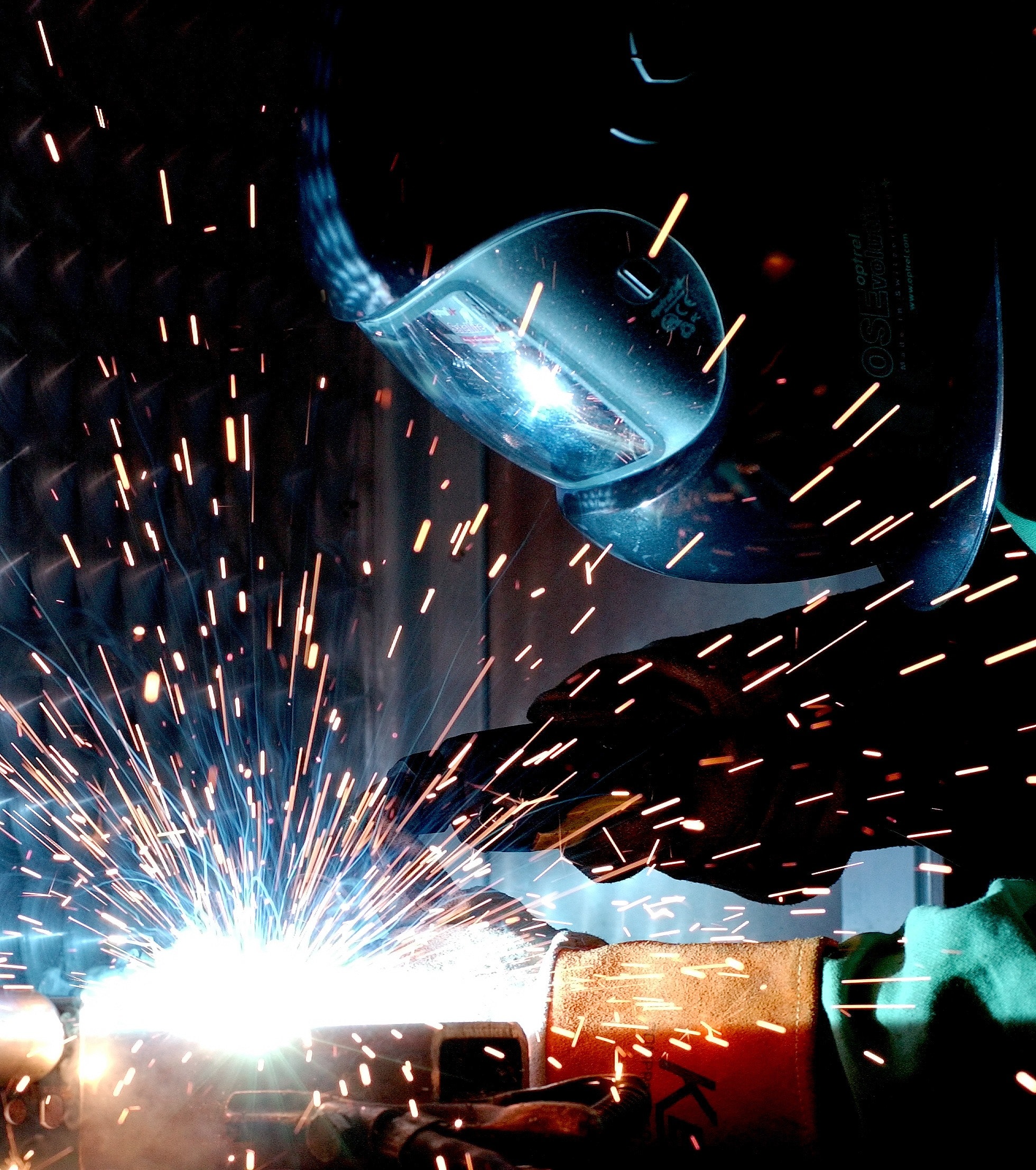 man welding global hydraulics